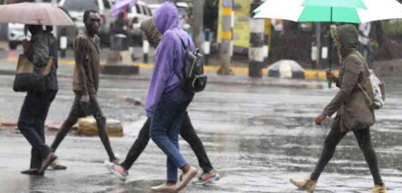 Kenyans walking in the rain PHOTO/Standard
