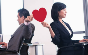 Employees in the office who are seemingly experiencing office romance PHOTO/iSTOCK