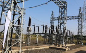 Photo of high-voltage transmission gantries, switchgear infrastructure, and a double-circuit transmission tower at a KETRACO substation powering the 86.4 km 132kV Nanyuki-Rumuruti Transmission Line. PHOTO/ KETRACO